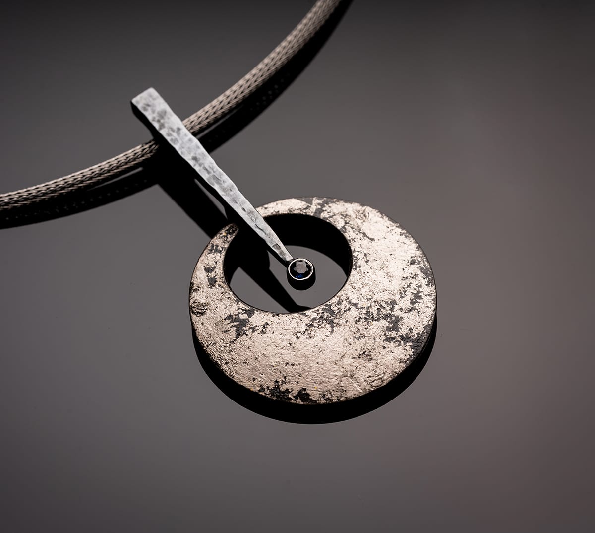 silver pendant with sapphire